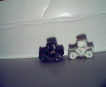 Two Cars, One Black and Other White, Made of Cast Iron!